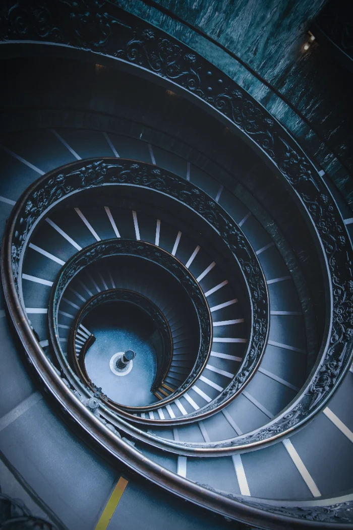 high-angle-shot-of-black-spiral-stairs-in-a-museum-2023-11-27-05-21-00-utc